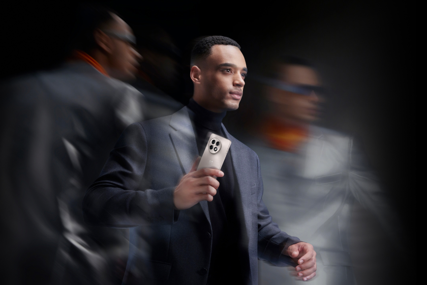 Poised professional holding smartphone